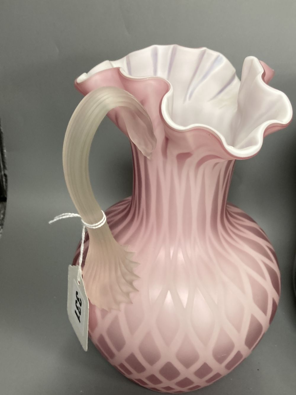 An opaline glass jug, an Edwardian jardiniere, a lustre mug and a novely whippet jug, 29cm